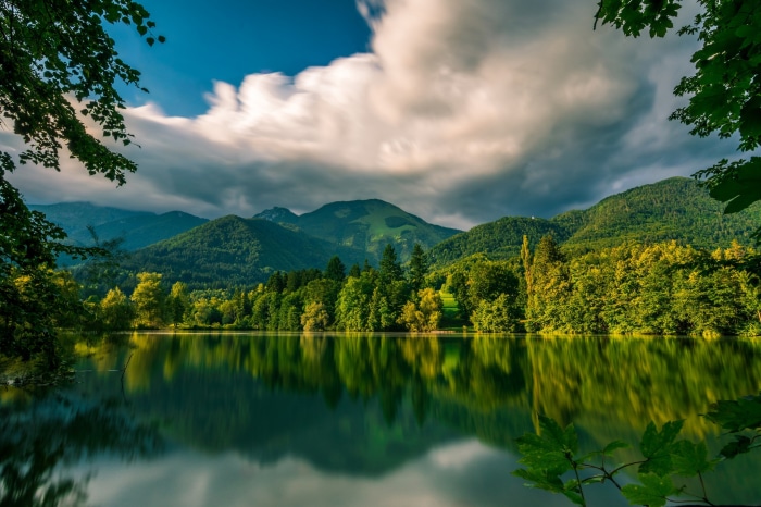 Lake Črnava with Mountains and Forest Reflection