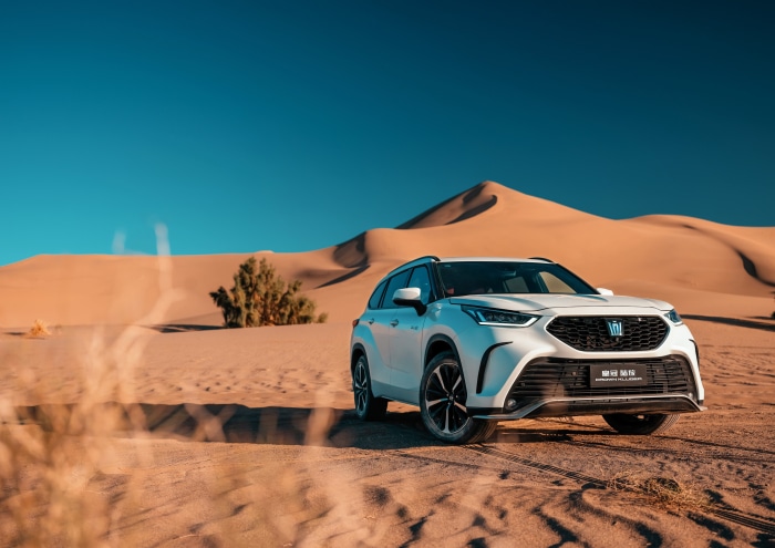White Toyota Crown SUV in the Desert