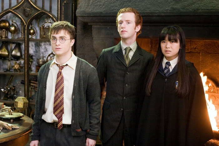 Harry Potter, Percy Weasley, and Cho Chang in a room