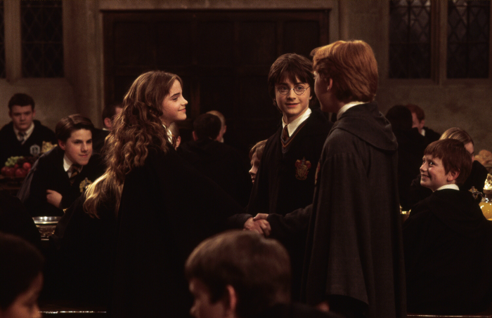 Harry Potter, Hermione Granger, and Ron Weasley in Great Hall