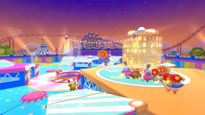 Fall Guys characters in a colorful carnival setting
