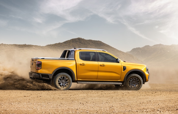 Yellow Ford Ranger Wildtrak driving off-road