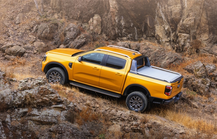 Yellow Ford Ranger Wildtrak on rocky terrain