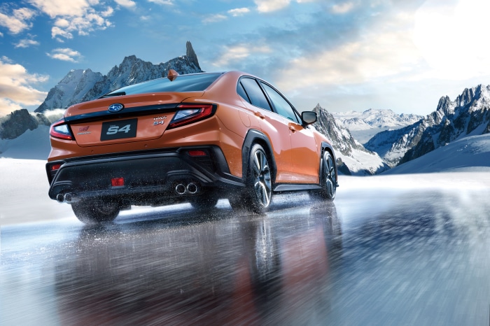 Orange Subaru WRX S4 STI Sport R on icy road