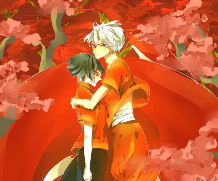 Two boys in orange robes in a red forest