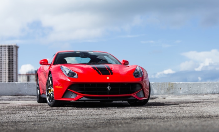 Red Ferrari F12berlinetta Supercar with Black Stripes