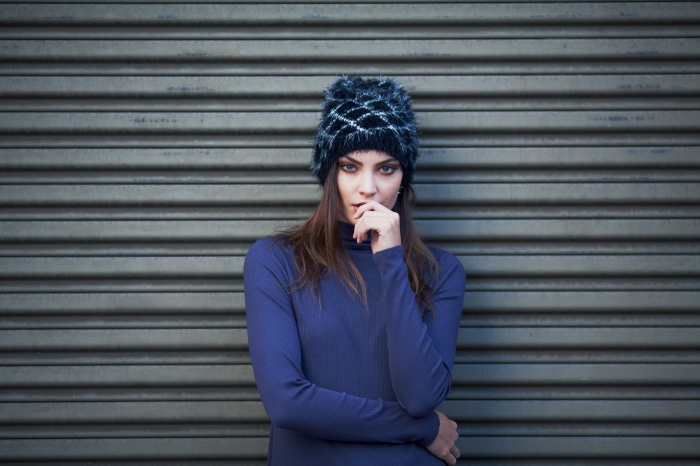 Model wearing a beanie and turtleneck