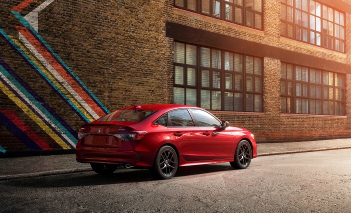 Red Honda Civic Sedan parked on street