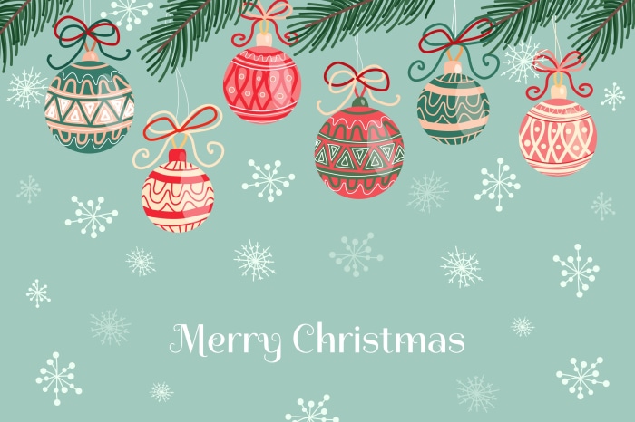 Merry Christmas ornaments on a pine branch