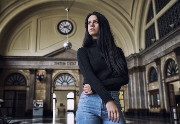 Woman with black hair in a train station