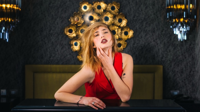 Model in red dress posing