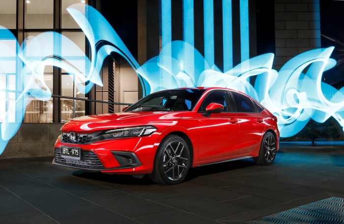 Red Honda Civic Hatchback VTi LX with light trails