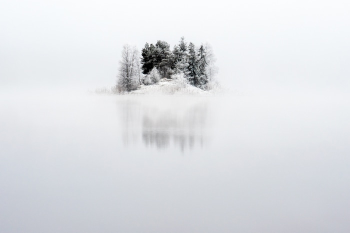 Winter morning island reflection in Arvika, Sweden