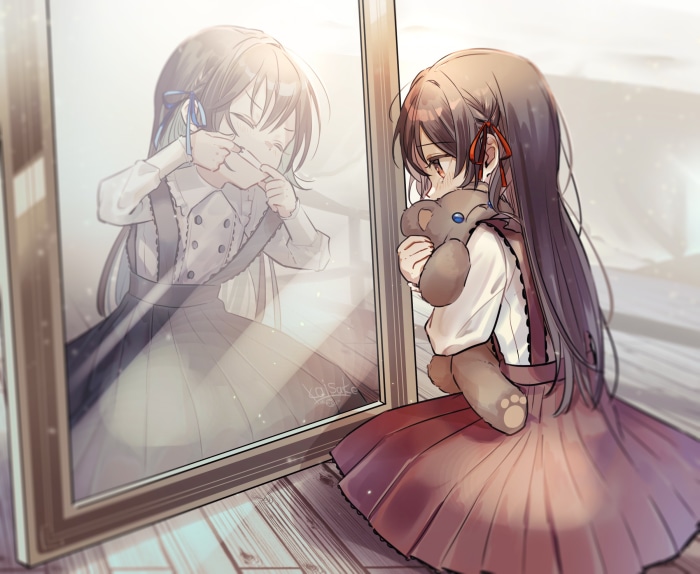 Girl hugging teddy bear looking in mirror