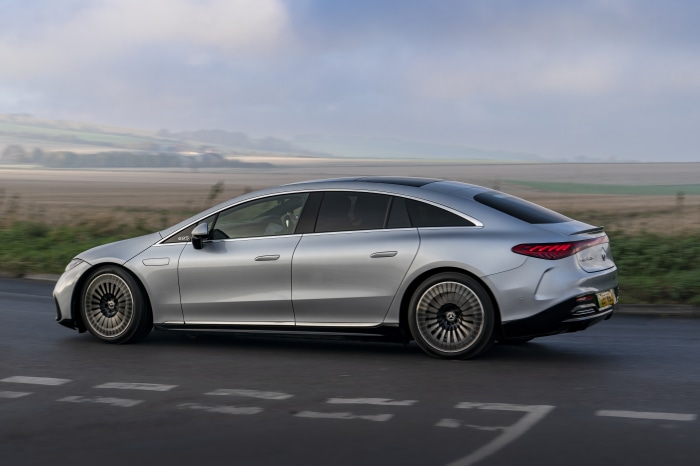 Silver Mercedes-Benz EQS 450 AMG Line driving on road