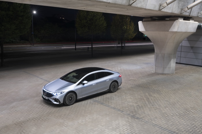 Silver Mercedes-Benz EQS 450 AMG Line sedan at night