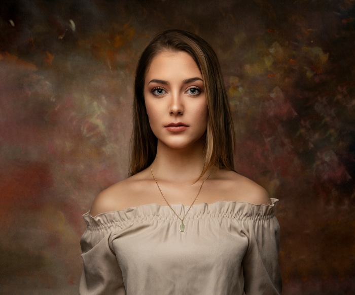 Portrait of a young woman with off-shoulder top