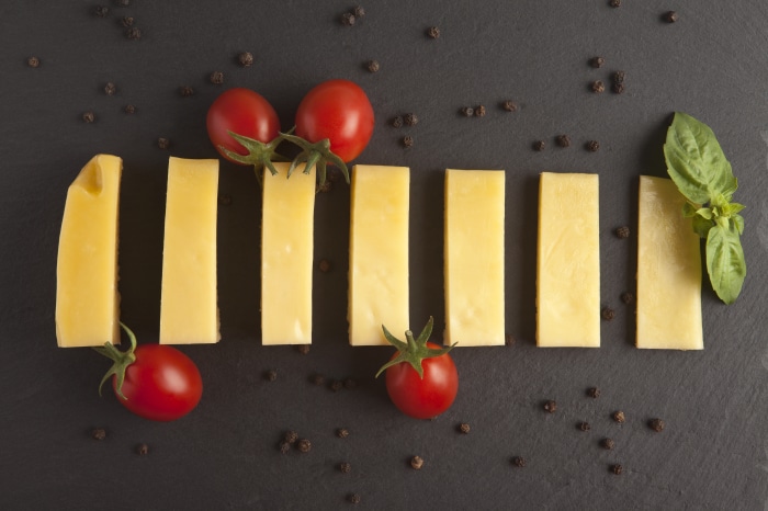 Cheese sticks with tomatoes and basil