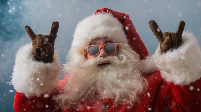 Santa Claus with sunglasses and snow