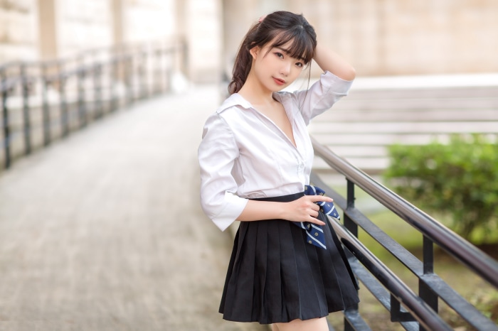 Asian girl in school uniform with tie
