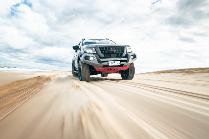 Nissan Navara driving on a sandy beach