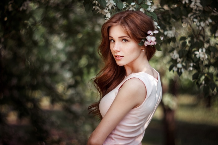 Redhead woman with flowers in her hair