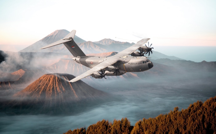 Airbus A400M Transport Aircraft flying over volcanoes