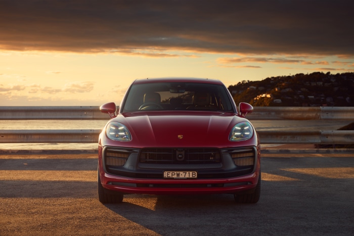 Red Porsche Macan GTS SUV at sunset