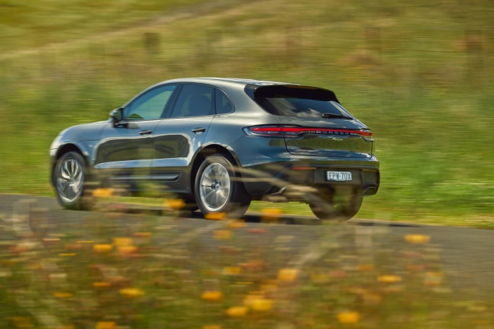 Porsche Macan SUV driving on a road