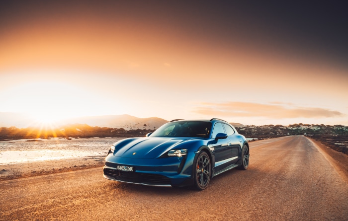 Blue Porsche Taycan 4S Cross Turismo on a road