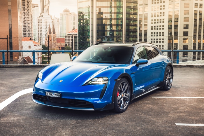 Blue Porsche Taycan 4S Cross Turismo parked in city
