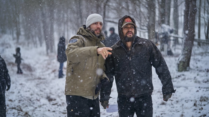 Jason Momoa and director on set in snow