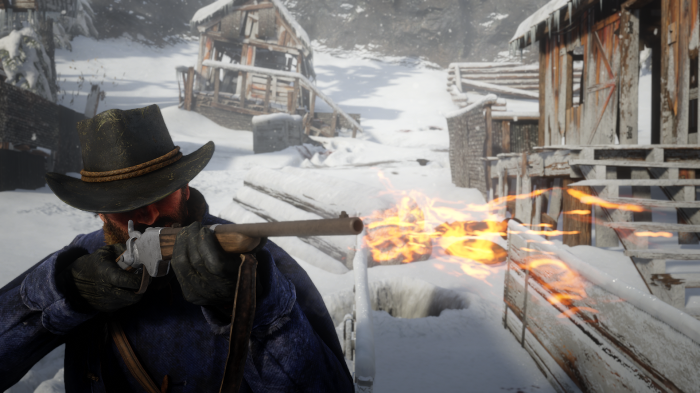 Man firing rifle in snowy village in Red Dead Redemption 2