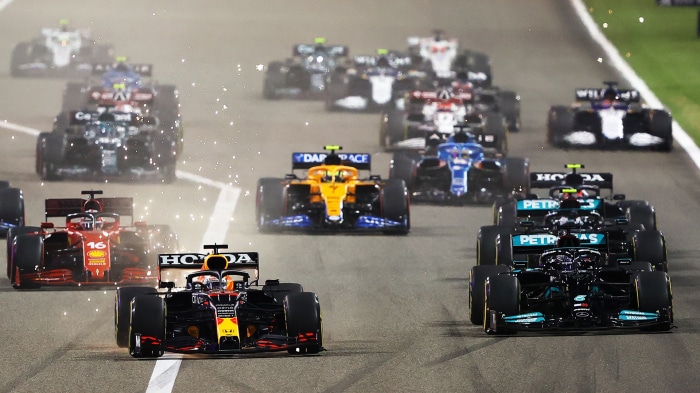 Formula 1 Cars Racing on Track