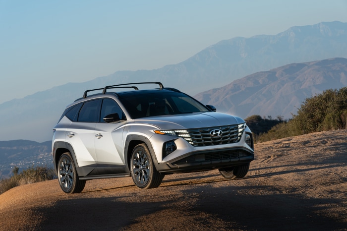 Silver Hyundai Tucson XRT SUV on a dirt road