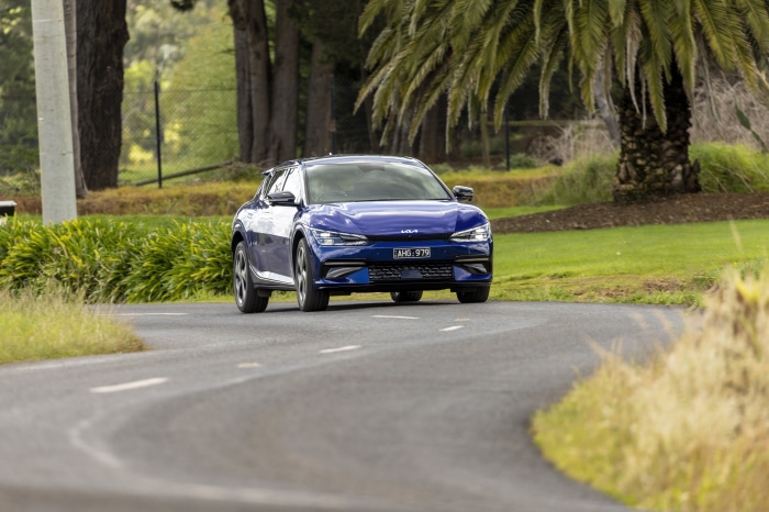 Blue Kia EV6 GT Line driving on a road
