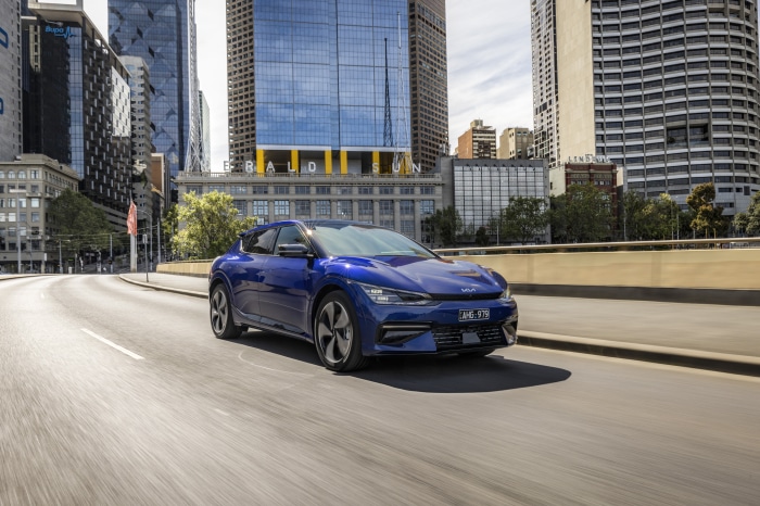 Blue Kia EV6 GT Line driving in city