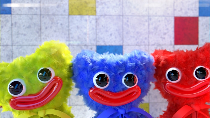 Three Huggy Wuggy toys in different colors