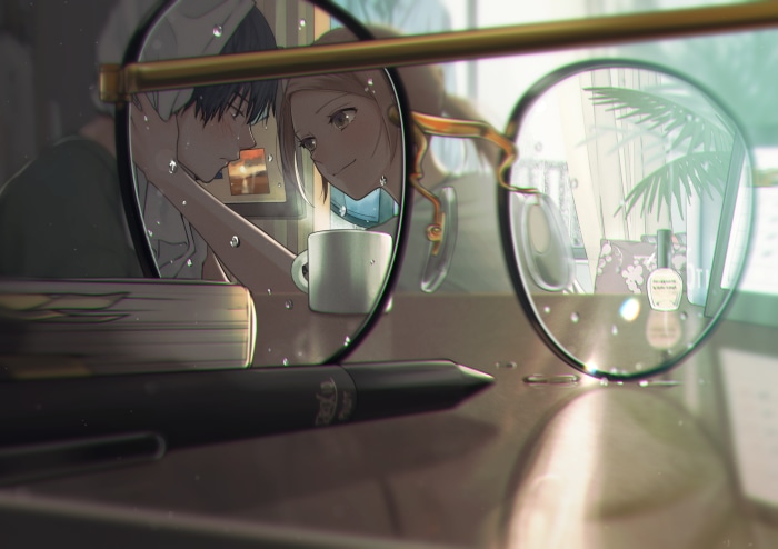 Couple through glasses with water droplets