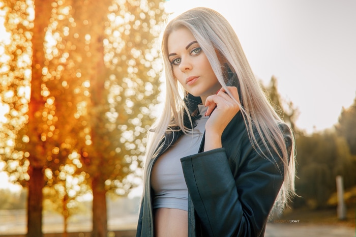 Woman with blonde hair in a black jacket
