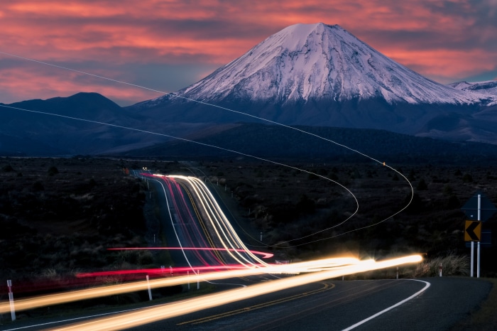 Long Exposure Road with Snow-Capped Mountain at Sunset