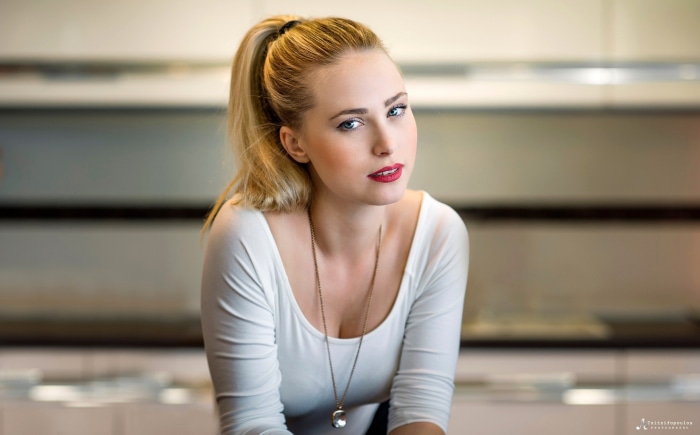 Woman with blonde ponytail and red lipstick