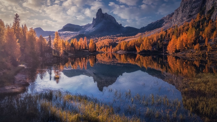 Lake reflection of autumn trees and mountains