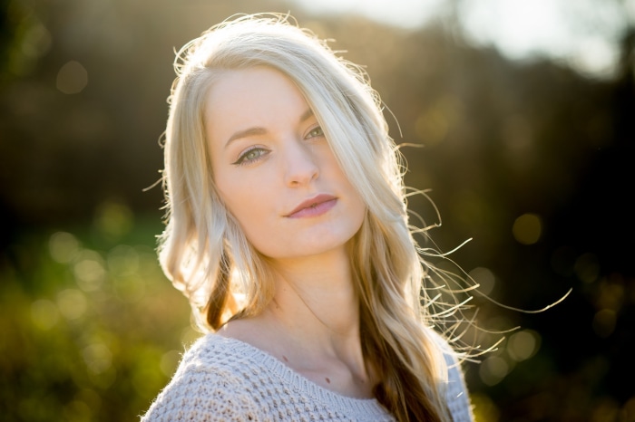 Woman with blonde hair in a sweater