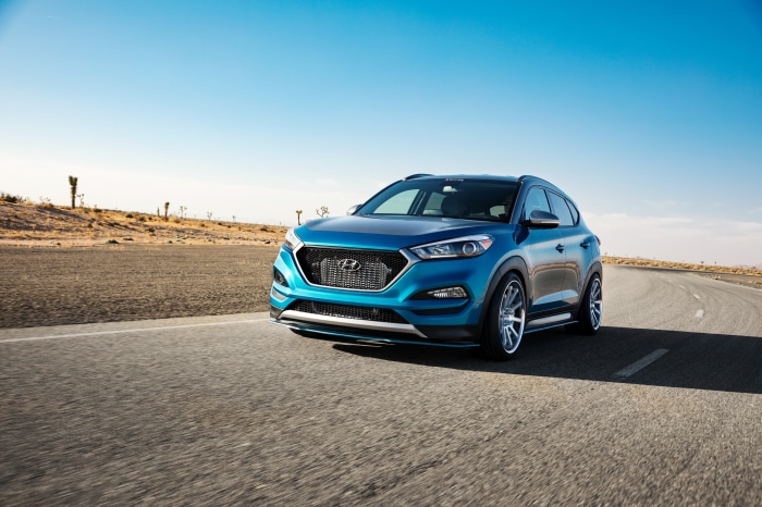 Blue Hyundai Tucson SUV on a Desert Road
