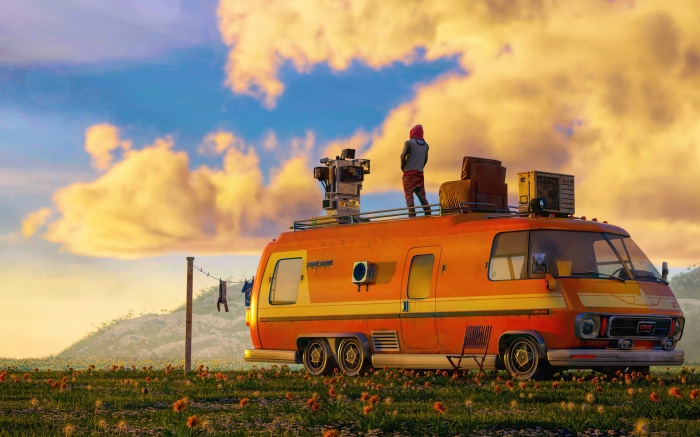 Person on top of a sci-fi van in a field