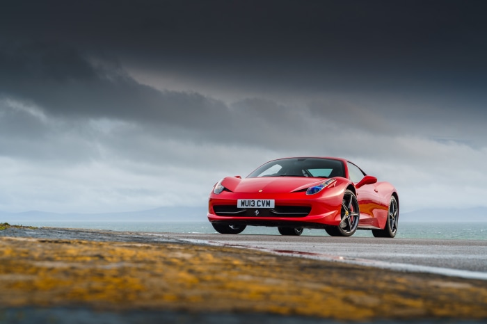 Red Ferrari 458 Italia on a Coastal Road