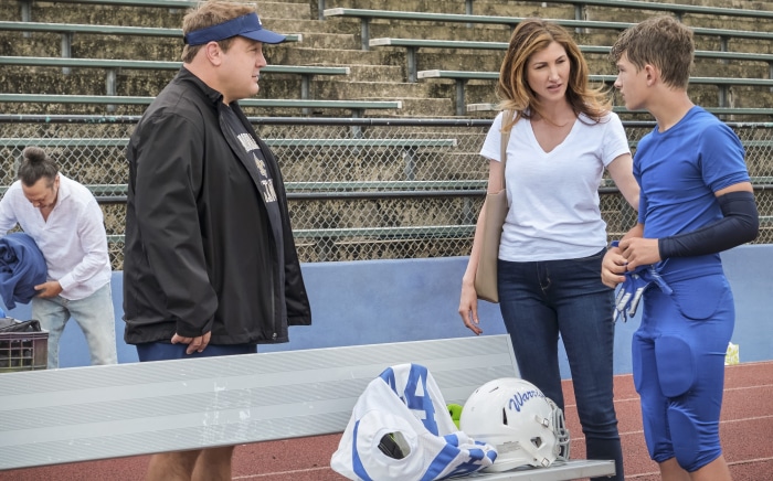 Kevin James and boy on football field