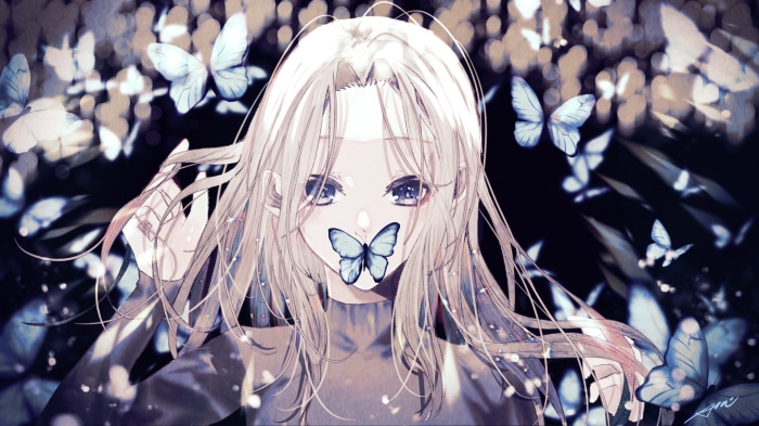 Girl with butterfly on her mouth surrounded by butterflies