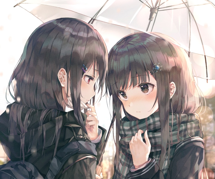 Two girls under an umbrella